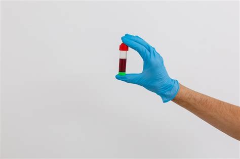 Premium Photo Hand Holding Blood In Test Tube Close Up