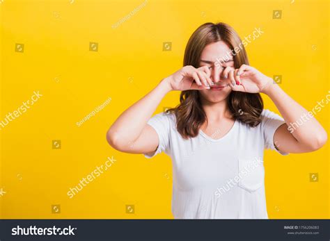 girl smiling wiping tears stock  images photography