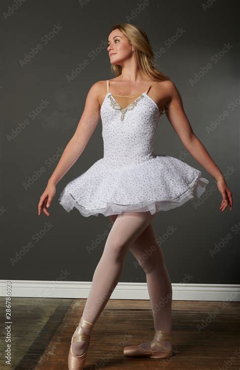 Beautiful And Stunning Blonde Female Ballerina Dances In Studio White Tutu Single Dramatic