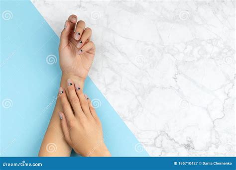 Womans Hands With Nude Nail Design Over Blue And Marble Background Stock Image Image Of