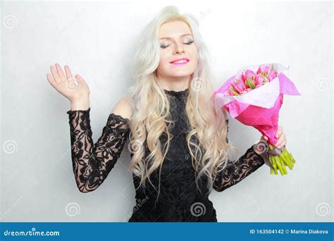 Tender Pretty Blonde Slim Teen Girl With Pink Flowers Cheerful Woman With Fresh Bouquet Stock