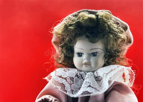 Beautiful Porcelain Brunette Doll Portrait With Vintage Dress And Curly Hairs And And Thoughtful