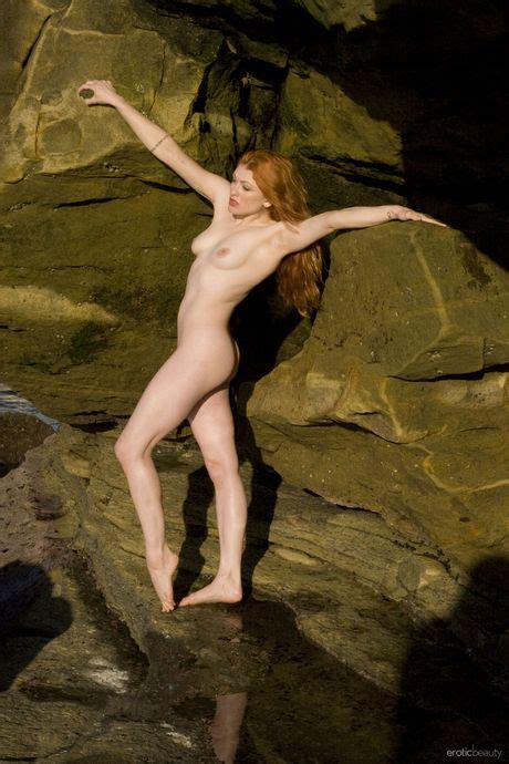 Natural Redhead Ginger R Displays Her Naked Body On A Rocky Beach