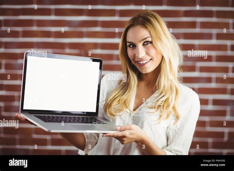 Beautiful Blonde Woman Showing Her Laptop Stock Photo Alamy