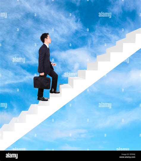 Business Man Stepping Up On Stairs With Cloud And Sky Background