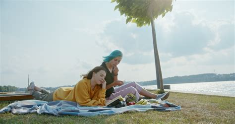 Lesbian Couple Resting On Beach Together Stock Footage Video