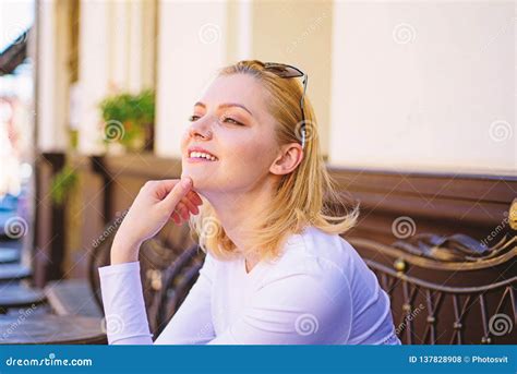 Pleasure On Her Mind Woman Blonde Dreamy Smiling Face Outdoors Building Background Defocused