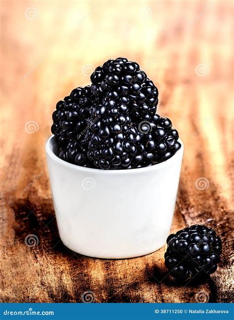 Blackberries In A Bowl On Wooden Table Closeup Stock Photo Image Of