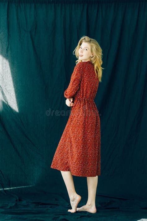 Beautiful Blonde Posing In A Red Dress A Girl With Long Curly Hair Stock Image Image Of Girl