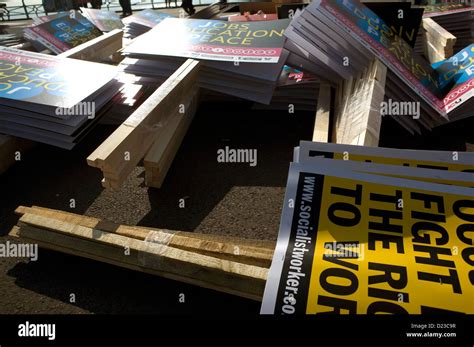 Protest signs and placards on the ground before a large protest in ...