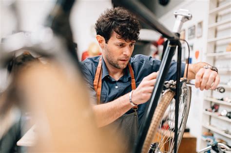 bike shop owner working  vintage bicycle stock photo  image