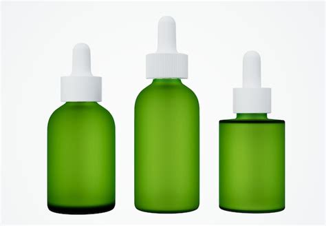 Premium Photo Set Of Different Green Glass Cosmetic Serum Dropper