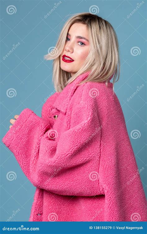 Beautiful Blonde Fashion Model Seductively Posing In Pink Coat Stock Image Image Of Outfit