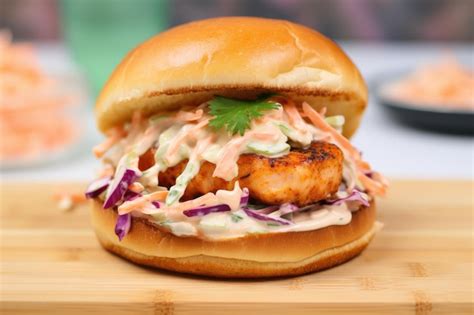 Premium AI Image | Shrimp burger on brioche bun with spiced mayo and coleslaw