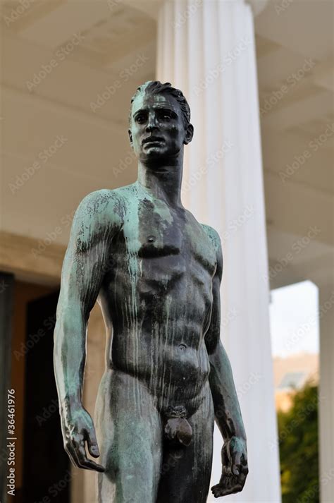 bronze statue of a athletic male body in front of a greek temple Stock ...