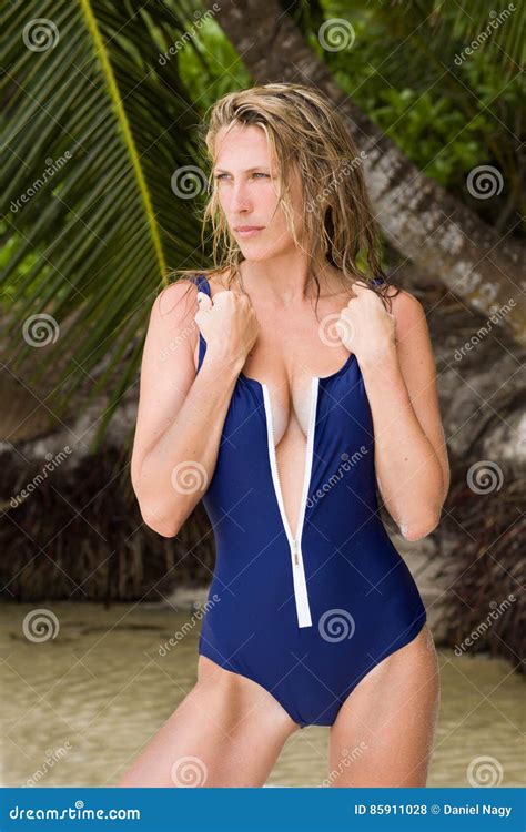 Beautiful And Blonde Woman In Blue Swimsuit Tropical Beach Stock Photo Image Of Pretty