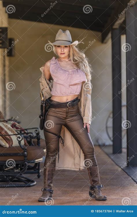 A Lovely Blonde Model Dressed As A Cowgirl Enjoys The American West Stock Photo Image Of