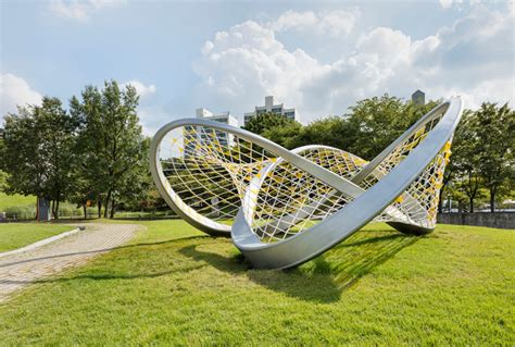 A twisted trefoil knot sculpture has arrived in this urban park