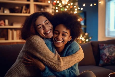 African American Gay Lesbian Couple Hugging And Having A Good Time At Christmas Sitting On The