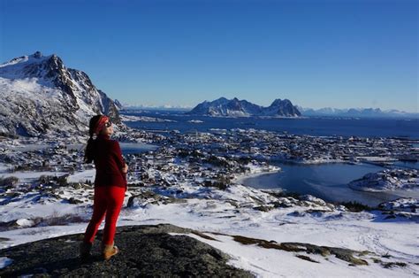 Premium Photo | Full length of woman standing on snow covered mountain