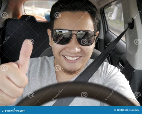 happy driver shows thumb   smile stock photo image  hire
