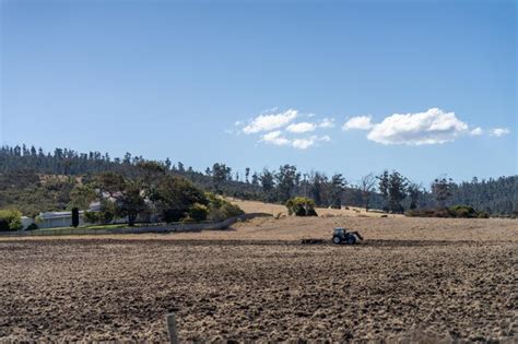 Premium Photo Tractor Plowing A Field In A Dry Hot Summer Farming Landscape Australia