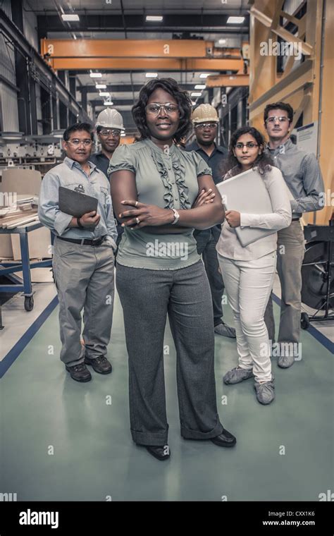 Workers Standing Together In Factory Stock Photo Alamy