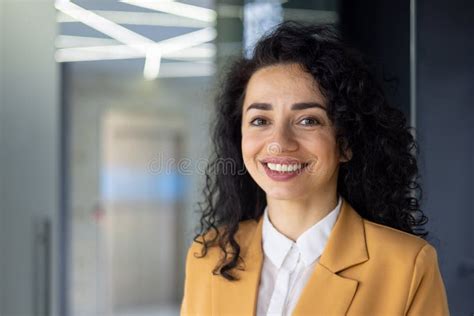 Closeup Portrait Of Mature Adult Business Woman Boss Smiling And Looking At Camera Pleased