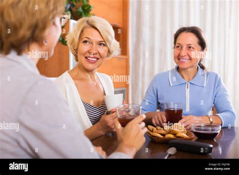 Happy Elderly Women Having Coffee Break At Office Focus On Blonde Woman Stock Photo Alamy