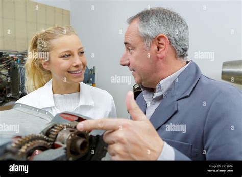 Aero Engineer And Apprentice Working In Hangar Stock Photo Alamy