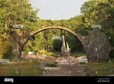 Bridge Of Devil Rakotzbrucke Over Rakotzsee Lake At Park Kromlau Near