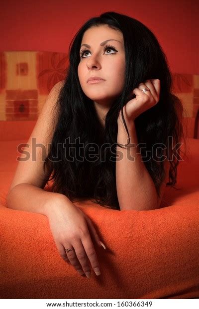 Beautiful Brunette Topless Lying On Bedin Stock Photo