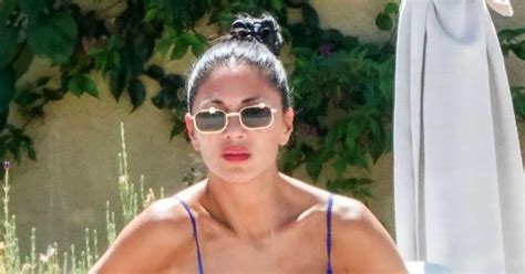 Nicole Scherzinger reveals incredible curves in tiny blue bikini on holiday with fiancé Thom