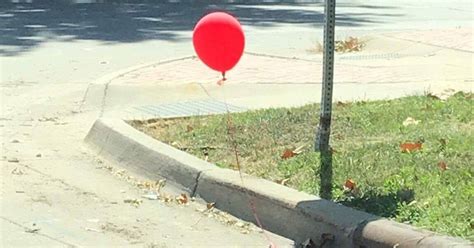 'It'-inspired red balloon tied to Des Moines sewer grate