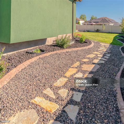 square frame landscaped garden pathway  suburban backyard day stock