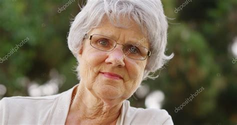 Mature Woman Smiling And Looking At Camera Stock Photo Mark Rocketclips 57339363