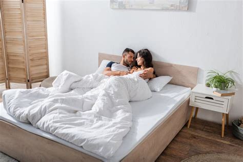 Bearded Man Hugging Brunette Girlfriend On Stock Image Image Of Flora