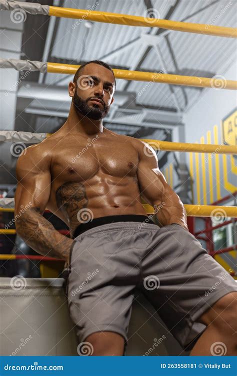 A Strong Man With A Naked Torso And Pack Abs Sits Near A Boxing Ring Stock Image Image Of