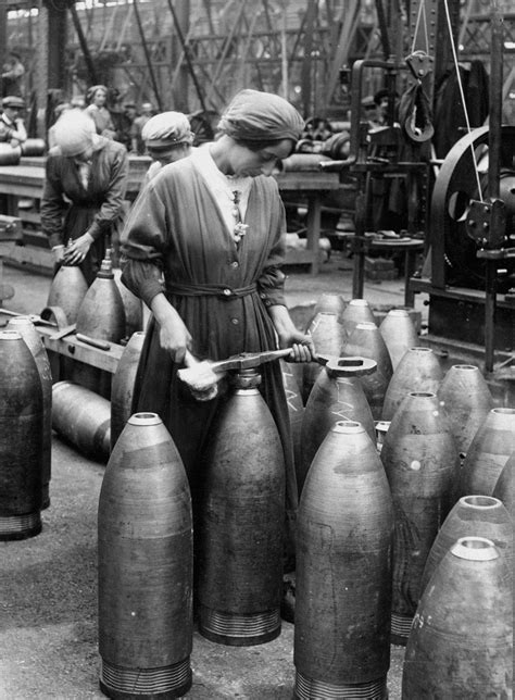 Female Munition Worker Preparing Shells In A Factory C Online