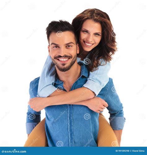 Happy Smiling Young Casual Couple On White Background Stock Photo