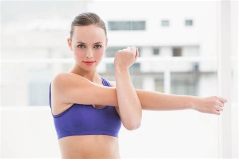 Premium Photo Fit Brunette Stretching Her Arms