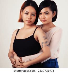 Studio Shot Photo Filipino Lesbian HugsのAI生成画像 Shutterstock