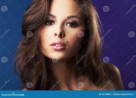 Beautiful Brunette Woman Lying In Bed In Sensual Lingerie Looking At Camera Stock Image