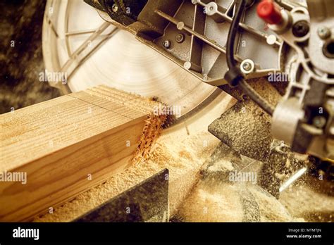 Close Up Of An Experienced Carpenter Using Circular Saw For Cutting