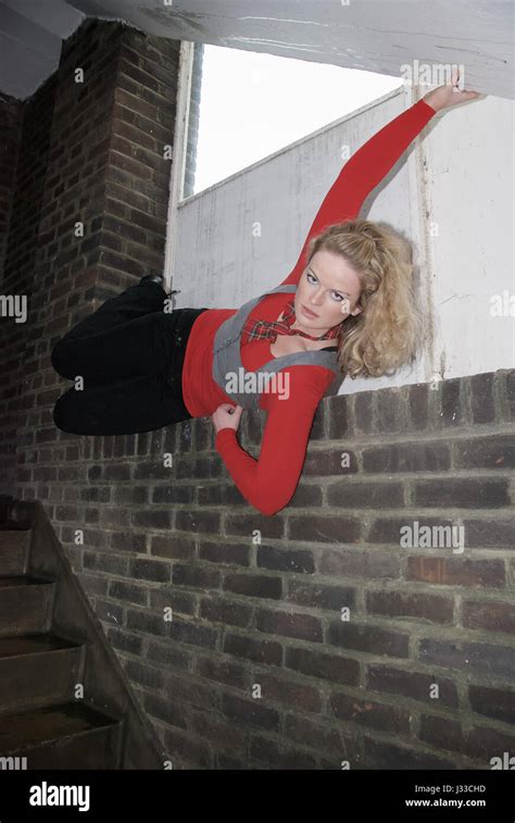 Beautiful Blonde Girl Wearing A Black And Red Outfit In An Urban Stairwell Stock Photo Alamy