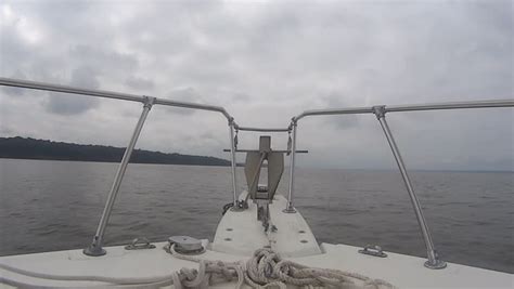 Nose Boat With Anchor And Mooring Ropes Lying In The Water Stock