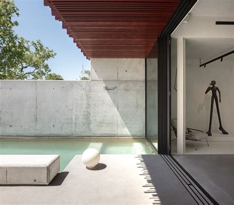 red timber-clad skin embraces park house's art nouveau facade in aveiro