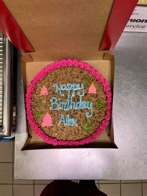 A Birthday Cake In A Box On Top Of A Counter