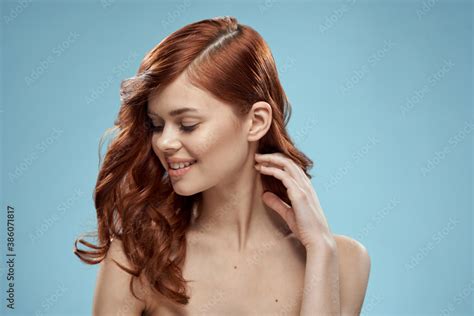 Beautiful Woman Curly Long Hair Smooth Hairstyle Naked Shoulders Cosmetics Care Blue Background