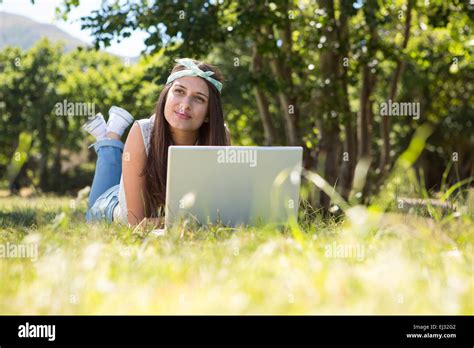 Pretty Brunette Using Laptop In Park Stock Photo Alamy